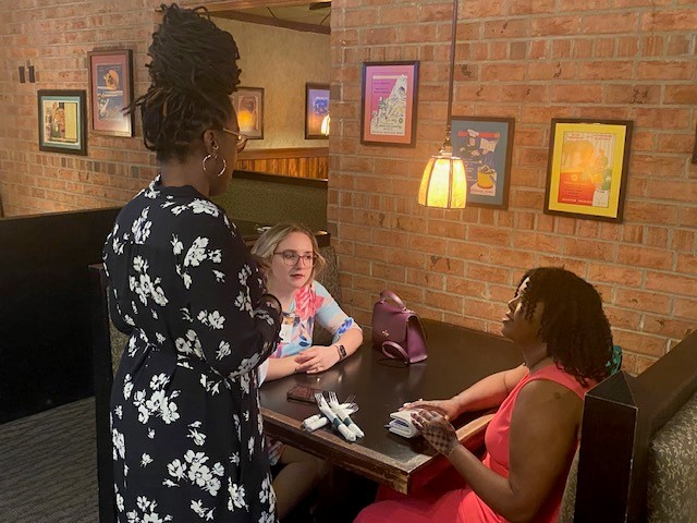 Online Master's Degree Program Director Dr. Isola Brown, welcomes graduates to a reception Friday, April 26. 