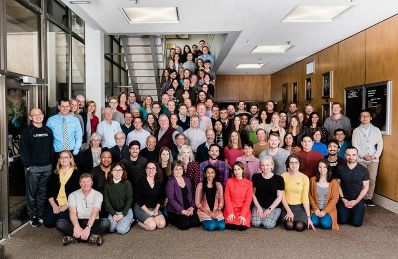 Faculty and staff posing in a large group