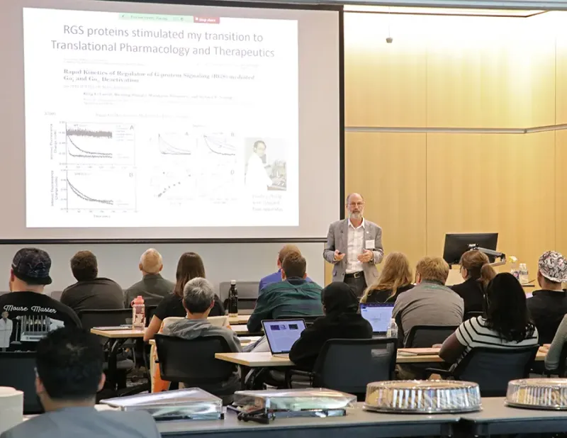 Dr. Richard Neubig delivers the keynote address at the recent Integrated Pharmacological Sciences Training Program retreat. (Photo by the MSU Department of Physiology)